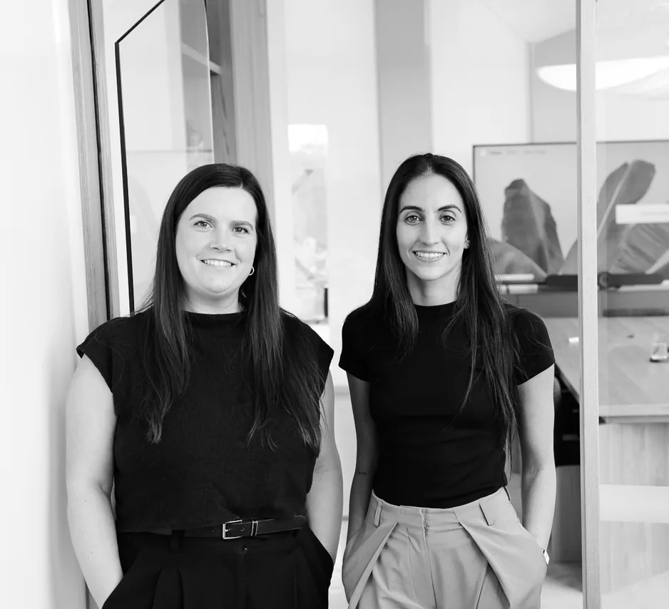 Customr founders Sarah and Soha standing in their office