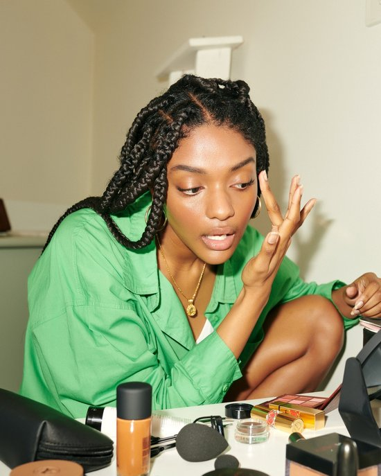 Adore Beauty customer applying makeup