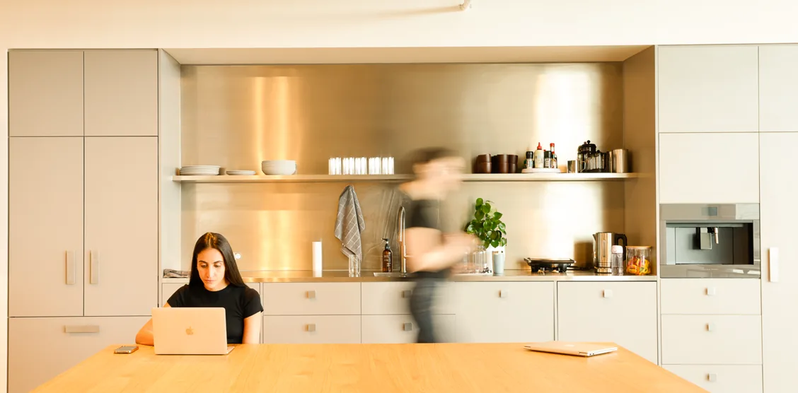 Working on a laptop in a bright kitchen