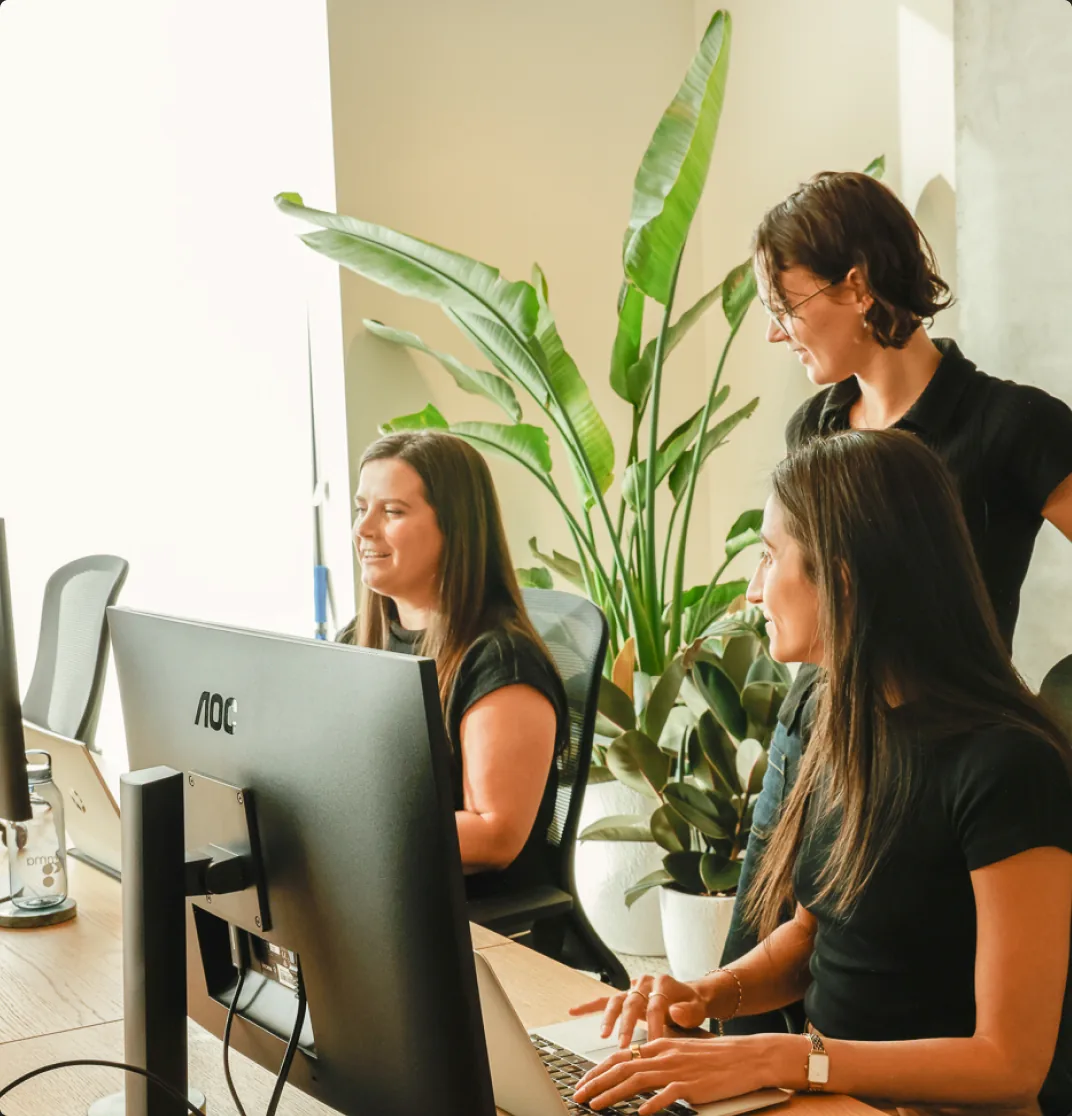 Customr team reviewing customer data together at a desk